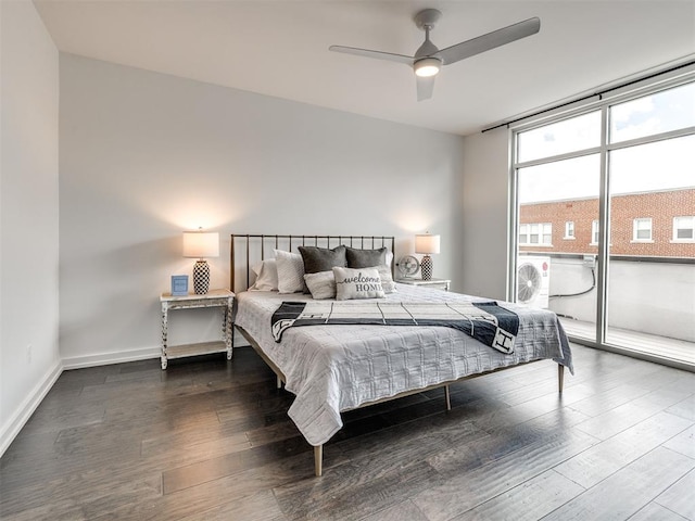 bedroom with wood finished floors, a ceiling fan, and baseboards