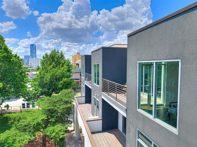 view of home's exterior featuring stucco siding and a balcony