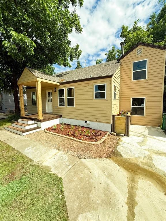 1212 NW 48th St, Oklahoma City, OK 73118 - view of front of house featuring a porch, crawl space, and a shingled roof