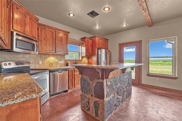 21698 SW Coombs Rd, Cache, OK 73527 - kitchen with appliances with stainless steel finishes, concrete flooring, decorative backsplash, a sink, and recessed lighting
