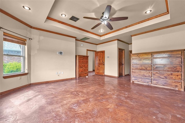 21698 SW Coombs Rd, Cache, OK 73527 - spare room featuring a tray ceiling, ornamental molding, baseboards, ceiling fan, and concrete flooring