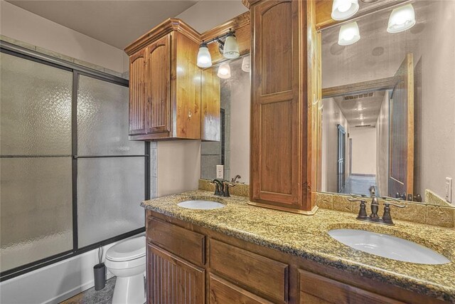 21698 SW Coombs Rd, Cache, OK 73527 - bathroom with toilet, enclosed tub / shower combo, and double vanity
