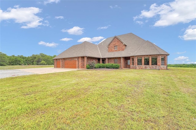 21698 SW Coombs Rd, Cache, OK 73527 - view of front of home featuring driveway, an attached garage, brick siding, and a front lawn