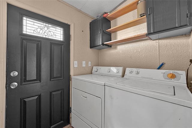 21698 SW Coombs Rd, Cache, OK 73527 - clothes washing area with washer and clothes dryer, cabinet space, and a textured wall