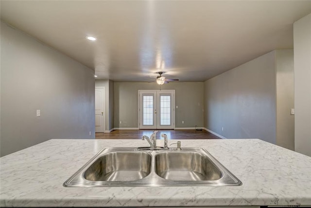 403 S Debra Ct Unit 401, Stillwater, OK 74074 - kitchen featuring a sink, wood finished floors, ceiling fan, baseboards, and recessed lighting