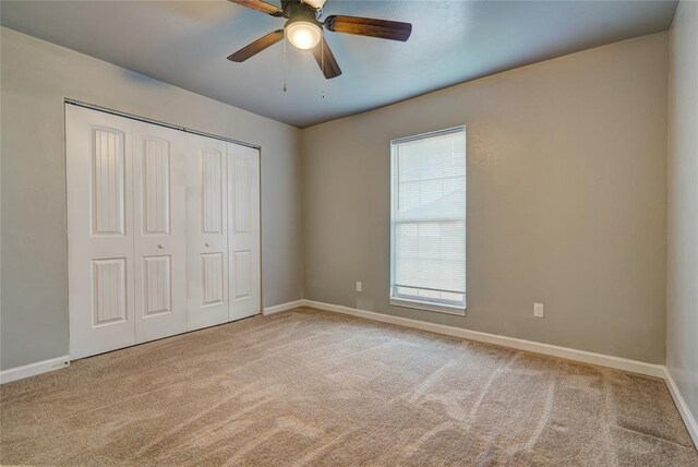 403 S Debra Ct Unit 401, Stillwater, OK 74074 - unfurnished bedroom featuring carpet flooring and baseboards