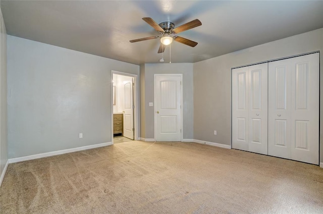 403 S Debra Ct Unit 401, Stillwater, OK 74074 - unfurnished bedroom with light colored carpet, baseboards, a closet, ensuite bath, and ceiling fan