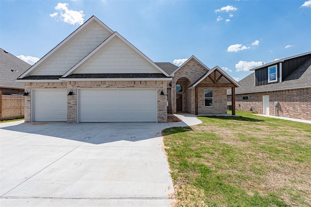 9205 Taggert Ln, Yukon, OK 73099 - view of front of property featuring concrete driveway, a garage, and brick siding