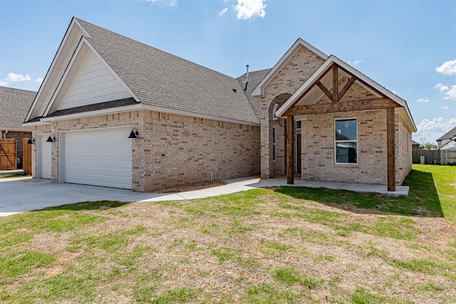 9205 Taggert Ln, Yukon, OK 73099 - ranch-style house featuring brick siding, concrete driveway, and a shingled roof