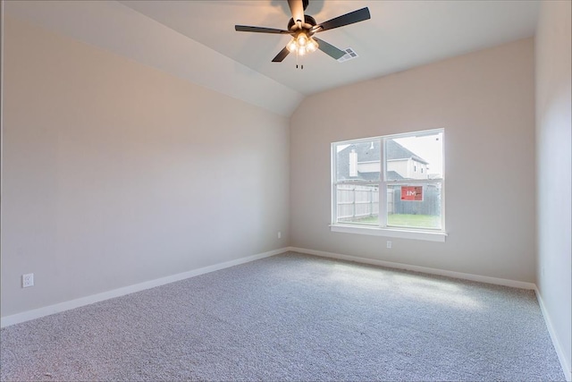 9205 Taggert Ln, Yukon, OK 73099 - empty room featuring light colored carpet, ceiling fan, baseboards, and vaulted ceiling