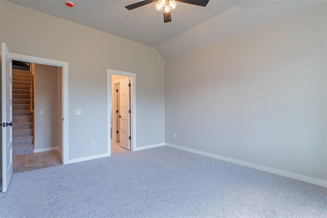 9205 Taggert Ln, Yukon, OK 73099 - unfurnished bedroom featuring light carpet, baseboards, lofted ceiling, and ceiling fan