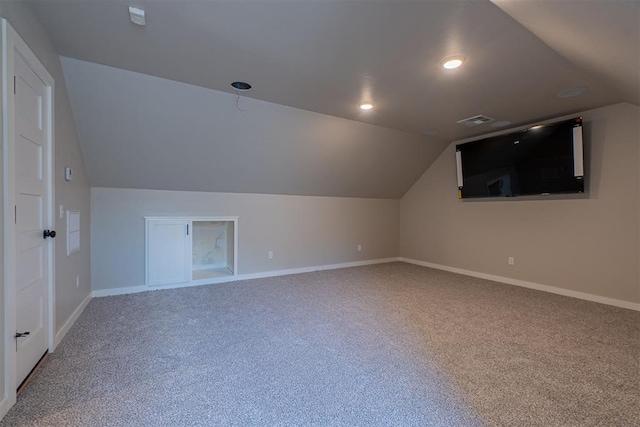 9205 Taggert Ln, Yukon, OK 73099 - bonus room featuring carpet floors, lofted ceiling, and baseboards