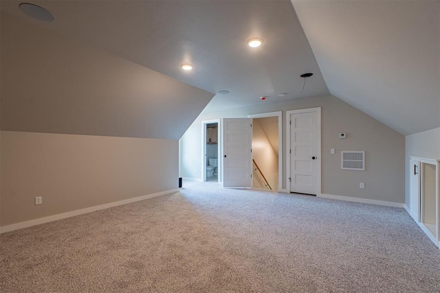 9205 Taggert Ln, Yukon, OK 73099 - additional living space with light carpet, vaulted ceiling, baseboards, and recessed lighting