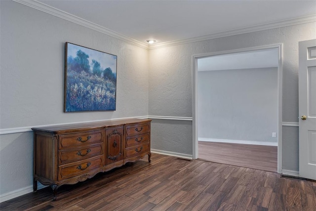 3804 NW 66th St, Oklahoma City, OK 73116 - unfurnished room with dark wood finished floors, baseboards, a textured wall, and ornamental molding