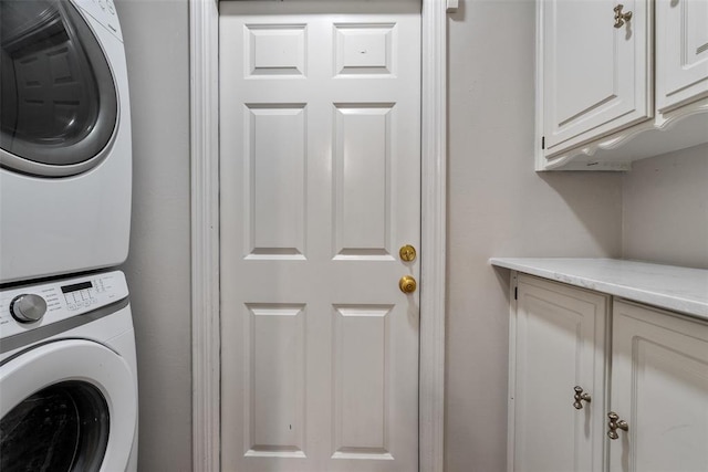 3804 NW 66th St, Oklahoma City, OK 73116 - clothes washing area featuring cabinet space and stacked washer / drying machine