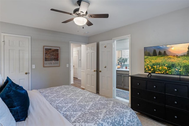 3804 NW 66th St, Oklahoma City, OK 73116 - bedroom featuring connected bathroom, a ceiling fan, and light colored carpet