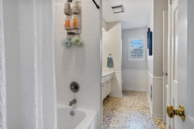 3804 NW 66th St, Oklahoma City, OK 73116 - bathroom with speckle patterned floor, shower / tub combo with curtain, baseboards, toilet, and vanity