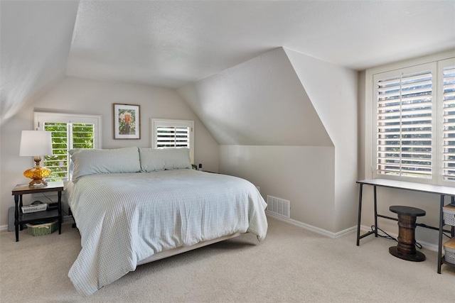 3804 NW 66th St, Oklahoma City, OK 73116 - carpeted bedroom featuring vaulted ceiling and baseboards