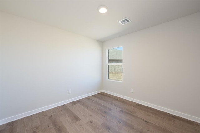 5515 Windstone Dr, Norman, OK 73072 - spare room with wood finished floors and baseboards