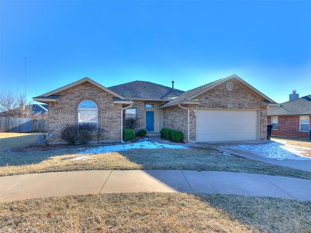 ranch-style house with an attached garage, brick siding, fence, a shingled roof, and concrete driveway
