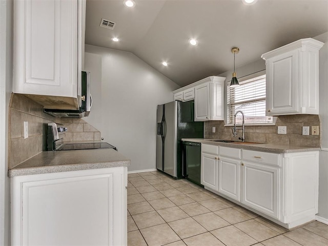 kitchen featuring a sink, dishwasher, stainless steel range with electric cooktop, lofted ceiling, and white cabinetry