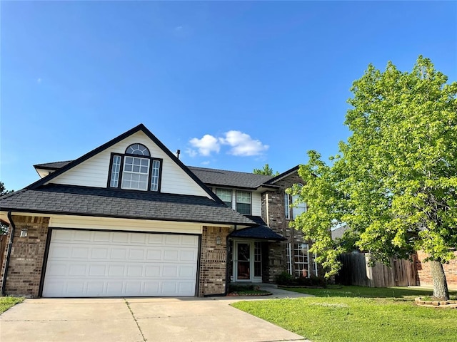 3113 SW 125th St, Oklahoma City, OK 73170 - traditional home with brick siding, concrete driveway, roof with shingles, and an attached garage