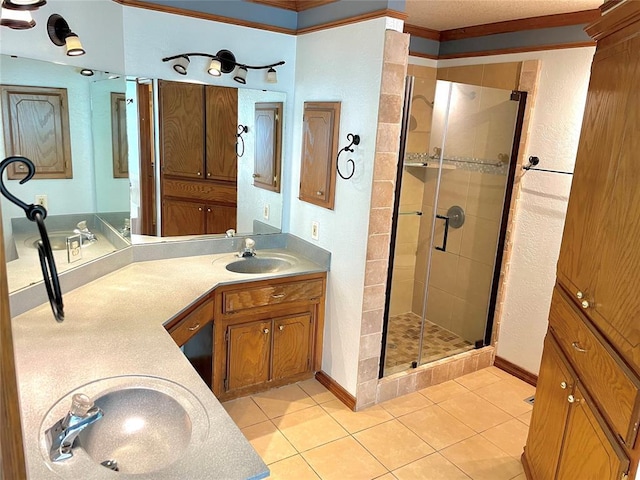 3113 SW 125th St, Oklahoma City, OK 73170 - bathroom with a shower stall, double vanity, tile patterned flooring, baseboards, and a textured wall