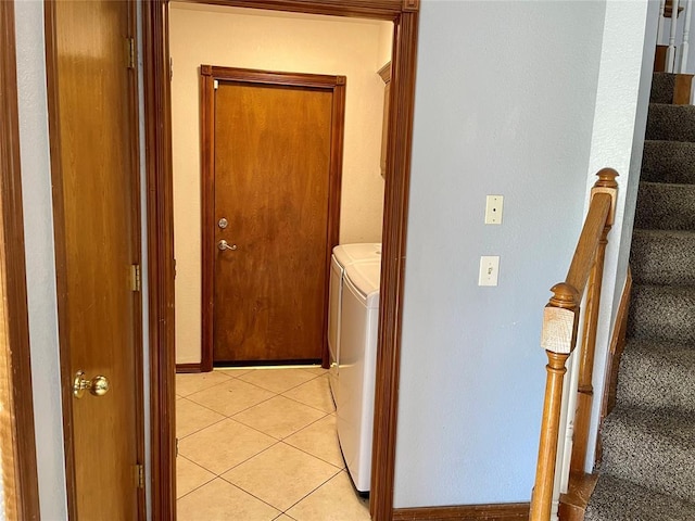 3113 SW 125th St, Oklahoma City, OK 73170 - washroom with washing machine and clothes dryer, light tile patterned floors, and baseboards