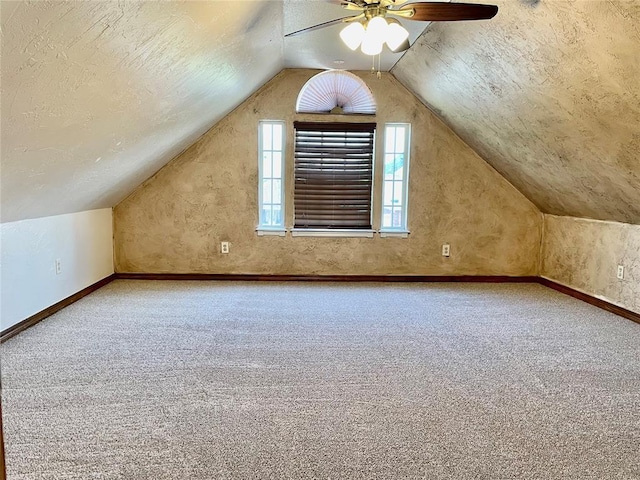 3113 SW 125th St, Oklahoma City, OK 73170 - bonus room featuring carpet, lofted ceiling, ceiling fan, a textured ceiling, and baseboards