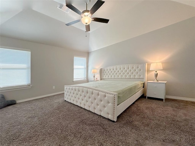 bedroom with dark colored carpet, vaulted ceiling, baseboards, and ceiling fan