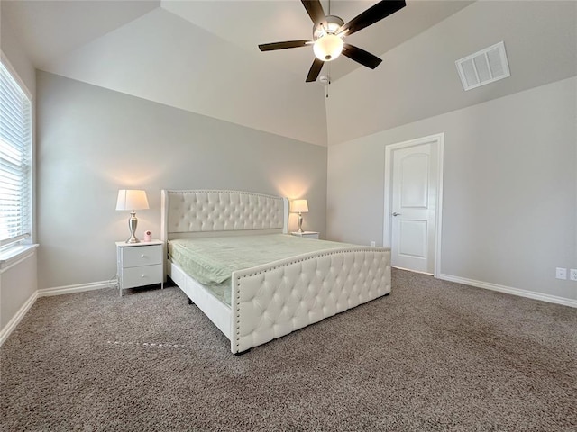 carpeted bedroom with vaulted ceiling, baseboards, and a ceiling fan