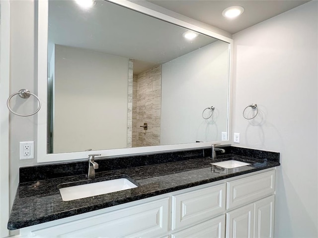 full bath with double vanity and recessed lighting