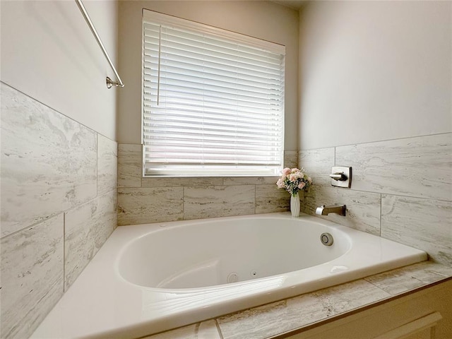 full bath with a whirlpool tub
