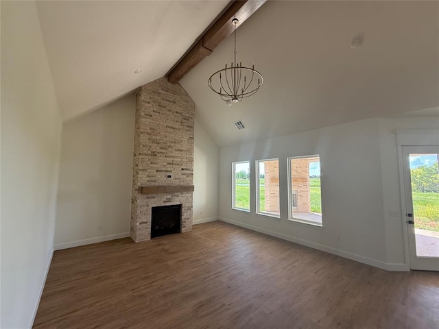 6921 Lake View Ct, Cashion, OK 73016 - unfurnished living room with a chandelier, beamed ceiling, wood finished floors, baseboards, and high vaulted ceiling