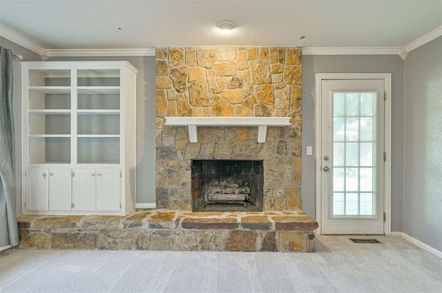 8720 Raven Ave, Oklahoma City, OK 73132 - unfurnished living room with carpet flooring, ornamental molding, a stone fireplace, and baseboards