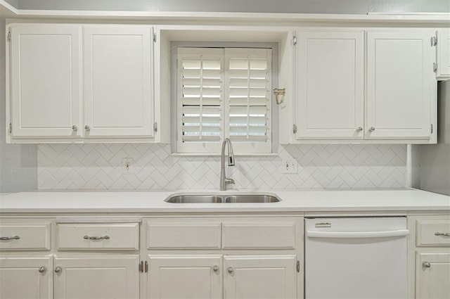 8720 Raven Ave, Oklahoma City, OK 73132 - kitchen featuring dishwasher, a sink, light countertops, and white cabinets
