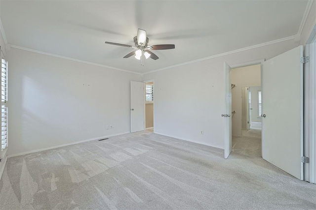 8720 Raven Ave, Oklahoma City, OK 73132 - unfurnished bedroom featuring light carpet, ornamental molding, baseboards, and a ceiling fan