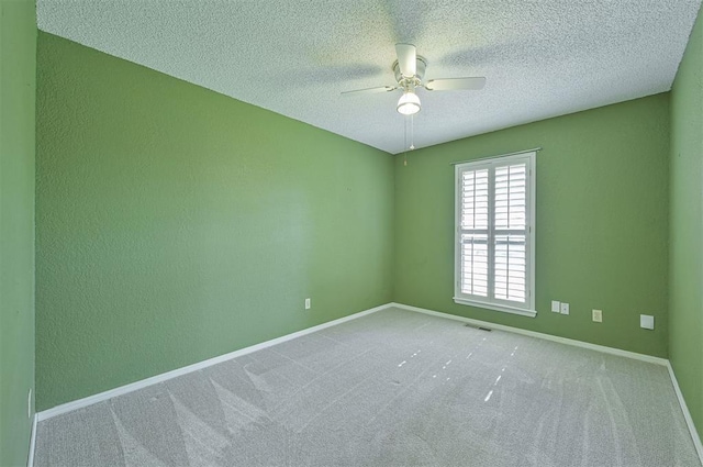 8720 Raven Ave, Oklahoma City, OK 73132 - carpeted empty room featuring a ceiling fan, a textured ceiling, and baseboards