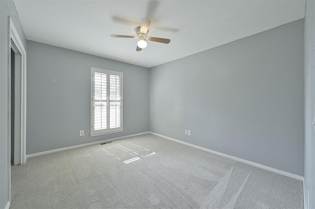 8720 Raven Ave, Oklahoma City, OK 73132 - empty room with a ceiling fan, carpet flooring, and baseboards