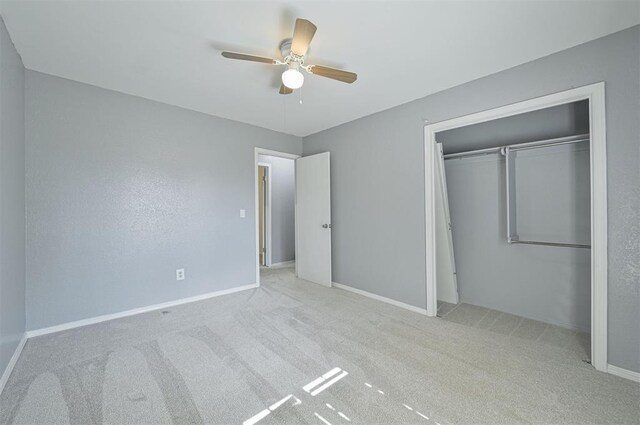 8720 Raven Ave, Oklahoma City, OK 73132 - unfurnished bedroom with carpet floors, a closet, baseboards, and a ceiling fan
