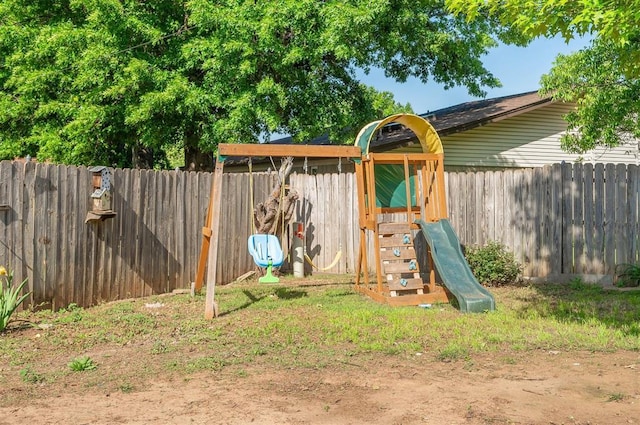 8720 Raven Ave, Oklahoma City, OK 73132 - view of jungle gym featuring a fenced backyard