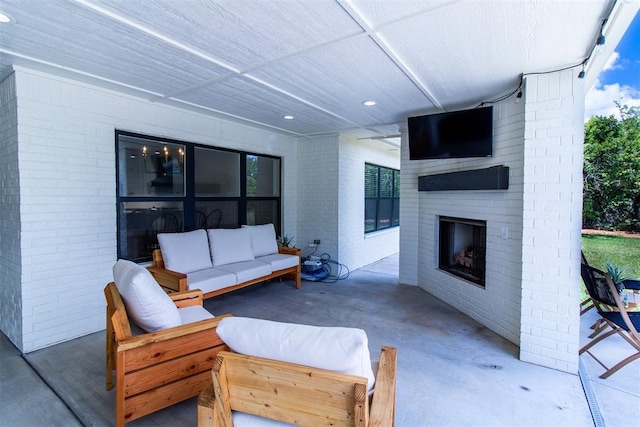 view of patio / terrace featuring an outdoor living space with a fireplace
