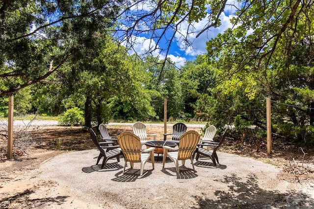 view of patio / terrace featuring an outdoor fire pit