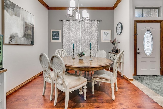 5608 Bent Creek Dr, Oklahoma City, OK 73135 - dining area featuring crown molding, a chandelier, wood finished floors, and baseboards