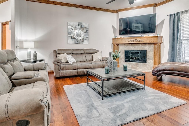 5608 Bent Creek Dr, Oklahoma City, OK 73135 - living room featuring crown molding, hardwood / wood-style floors, a ceiling fan, and a high end fireplace