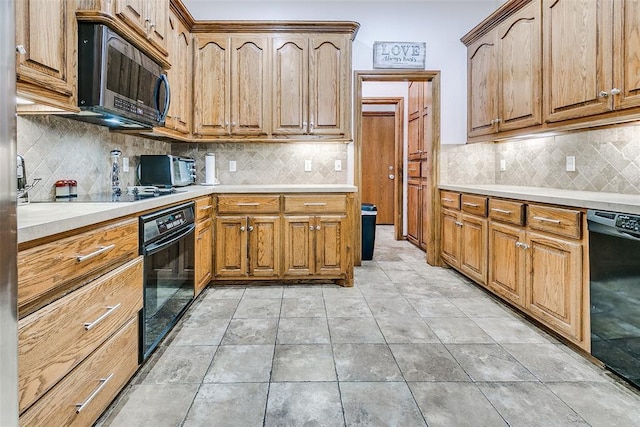5608 Bent Creek Dr, Oklahoma City, OK 73135 - kitchen with black appliances, light countertops, backsplash, and brown cabinetry
