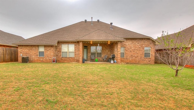 5608 Bent Creek Dr, Oklahoma City, OK 73135 - rear view of property with a shingled roof, a patio area, and brick siding