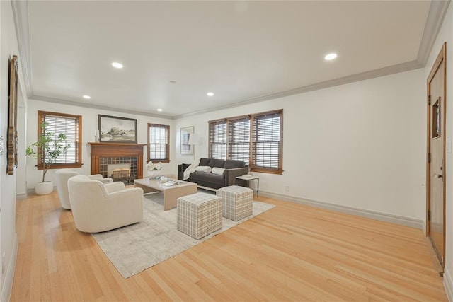 2650 NW 25th St, Oklahoma City, OK 73107 - living room featuring crown molding, baseboards, light wood finished floors, a fireplace, and recessed lighting