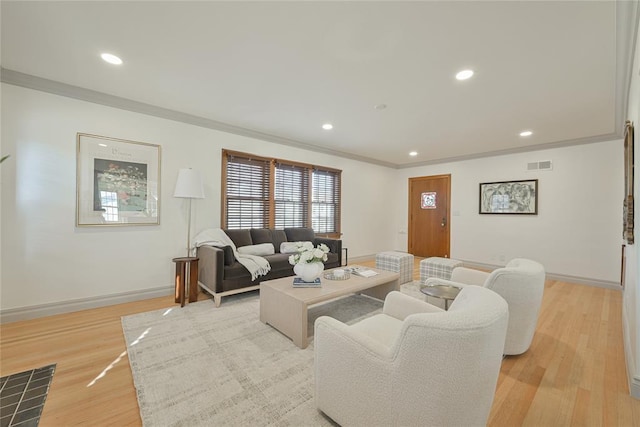2650 NW 25th St, Oklahoma City, OK 73107 - living room featuring baseboards, light wood finished floors, ornamental molding, and recessed lighting