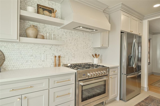 2650 NW 25th St, Oklahoma City, OK 73107 - kitchen featuring stainless steel appliances, custom range hood, open shelves, ornamental molding, and light countertops